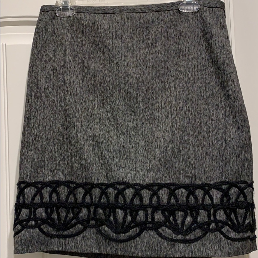 Flattering, accented with yarn embroidery at hem.